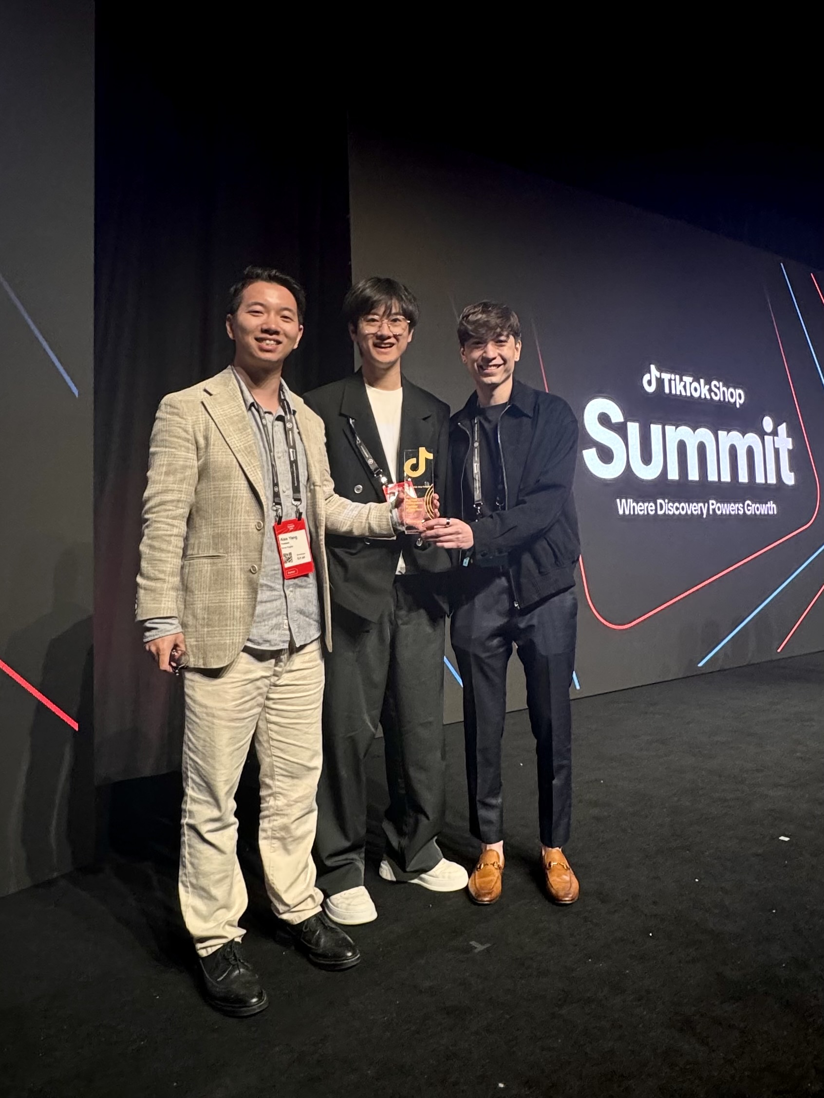 Team members holding an award at the TikTok Shop Summit